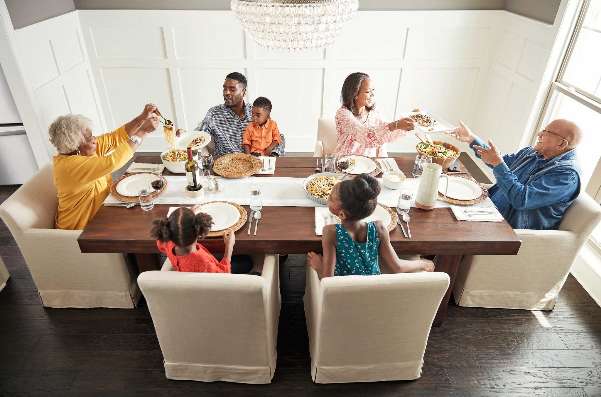 Family having breakfast at the dining table | Webb Carpet Company